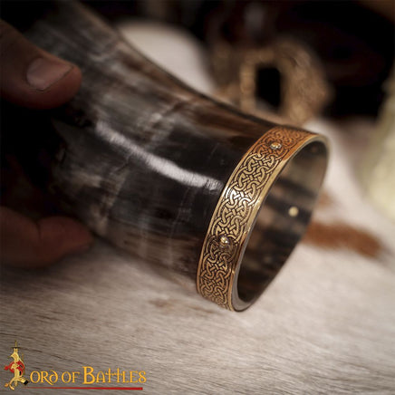 Drinking horn with decorative knotwork brass design trim