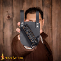 Black sword holder with adjustable tie closure