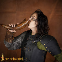 Brown colour drinking horn with carving