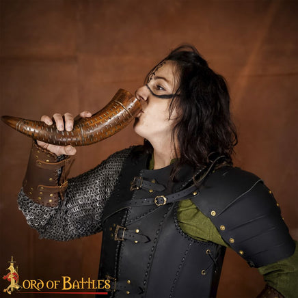 Brown colour drinking horn with carving