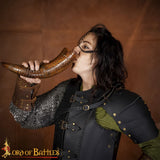 Brown colour drinking horn with carving