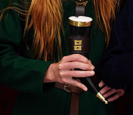 Drinking horn with brass rim and tip, with brown holder decorated with quatrefoil mounts