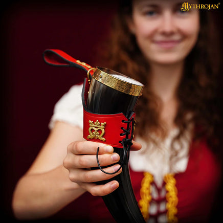 Viking drinking horn with brass trim and leather holder