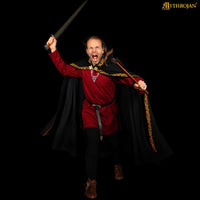 black wool cloak with brass Viking clasp and gold embroidery trim