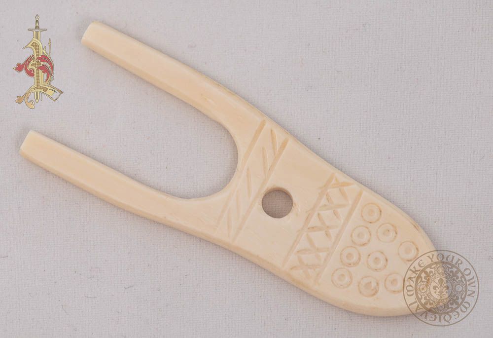 Bone viking lucet with carving