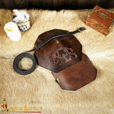 Celtic shoulder armour made from brown leather with boar design