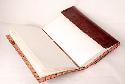 Book of shadows with green stone