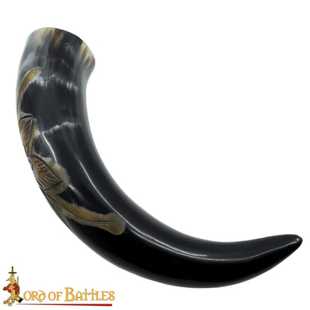 Drinking horn with carved design of a flower