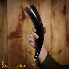 Drinking horn with decorative brass design