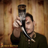 Drinking horn with decorative brass fittings