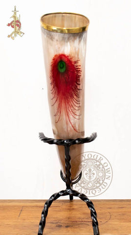 Drinking horn with red feather and green eye