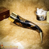 Drinking horn with with thick brass trim and long brass end