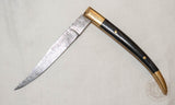 Medieval damascus folding knife with horn and brass handle