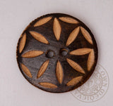 Wooden button with carved design