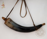 black powder horn with leather strap and wooden stopper