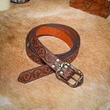 brown leather Belt with decorative flower pattern stamped onto belt strap