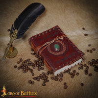 embossed leather journal with stitched cover and decorative stone