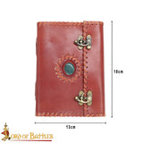 leather journal with latch and green stone