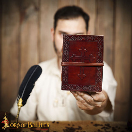 middle ages diary with cross on cover