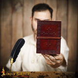 middle ages diary with cross on cover